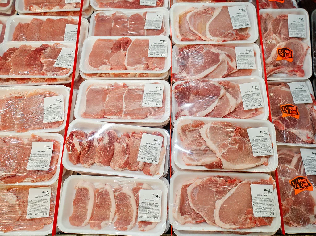Packaged pork chops in the meat case